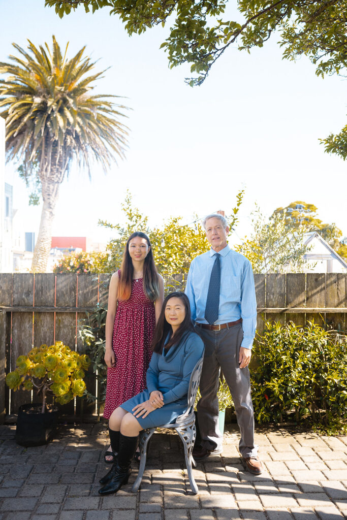 Family of three posing for their at-home family photos in San Francisco, California