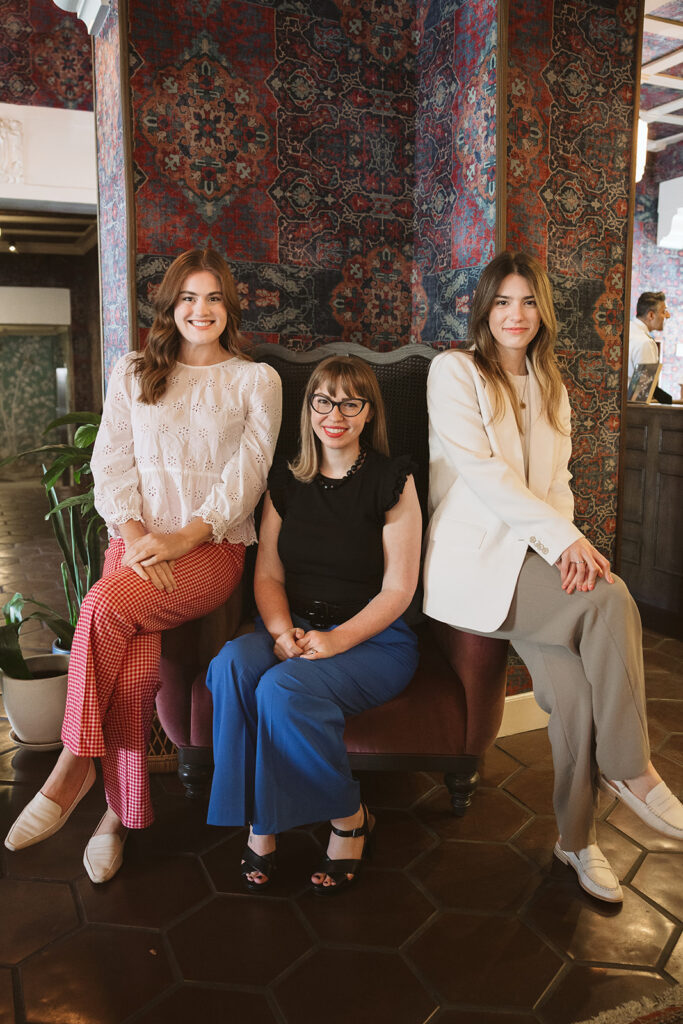 Three women posing for their branding photos at The Graduate Hotel