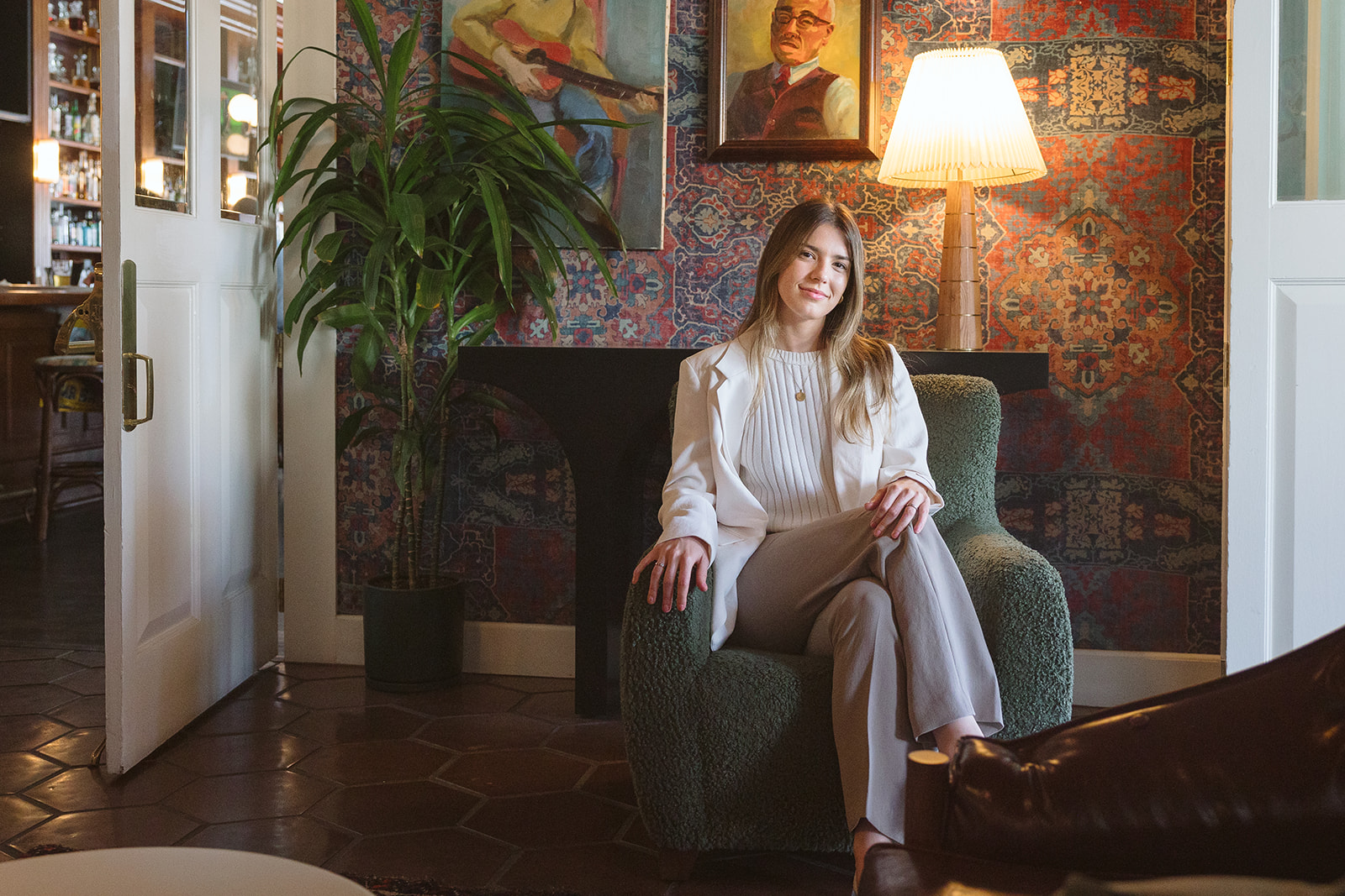 Woman sitting in a chair at The Graduate Hotel for her creative brand photoshoot in Berkeley