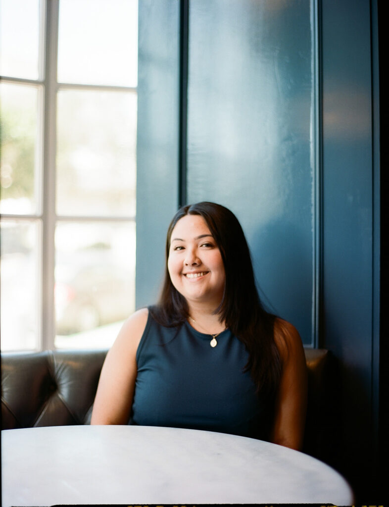 Film photo of a woman posing for her branding photos at The Graduate Hotel in Berkeley, California