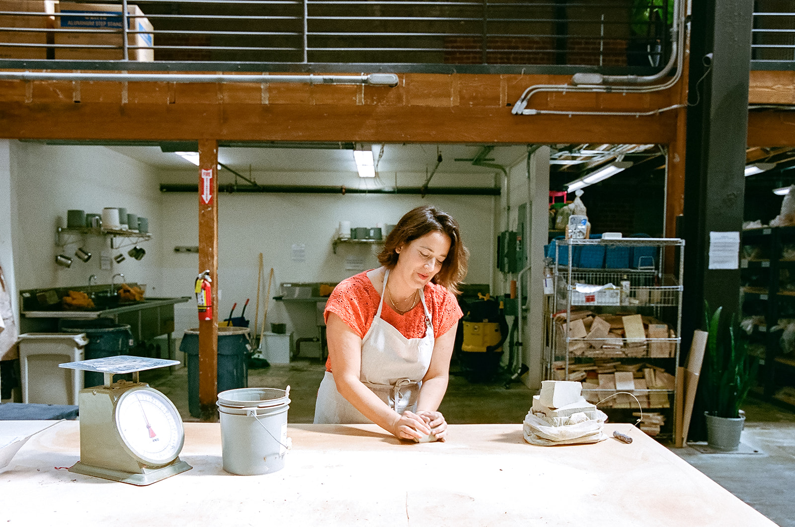 Woman molding clay