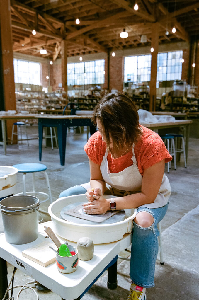 Woman doing pottery for her creative film branding session for The Pottery Studio in San Francisco