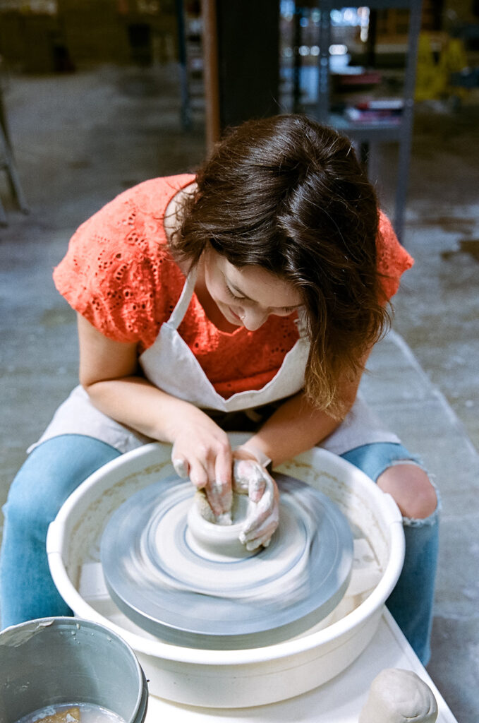 Woman doing pottery for her creative film branding session for The Pottery Studio in San Francisco