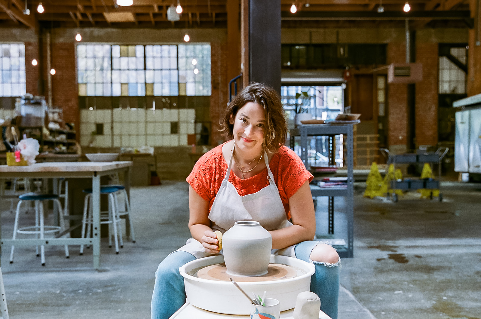 Woman creating with clay for creative film brand photography for The Pottery Studio San Francisco