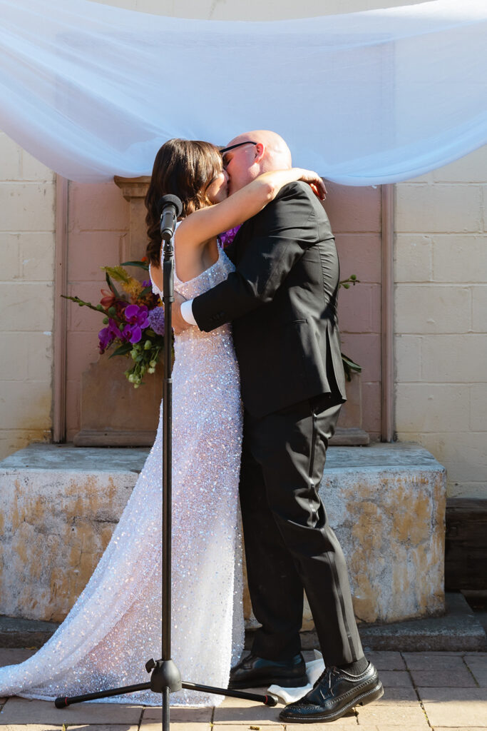 Bride and groom kissing