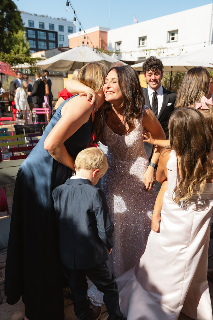 Bride hugging guests after the ceremony