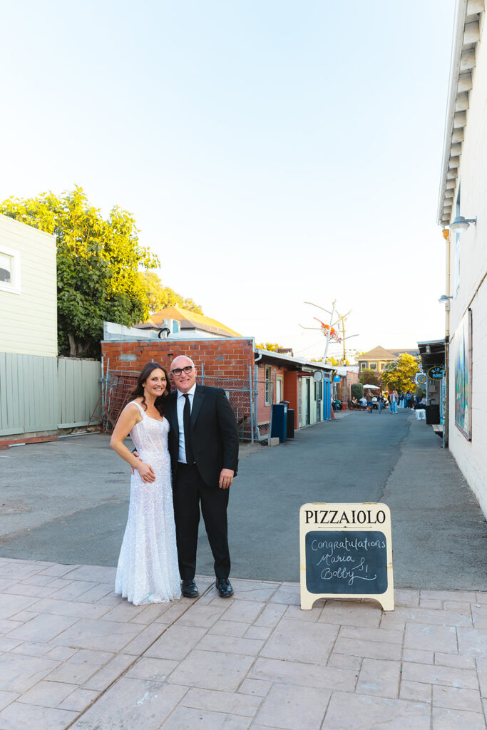 Bride and grooms wedding portraits outside of Pizzaiolo in Oakland, California