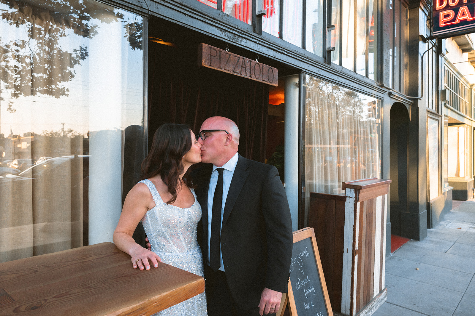 Bride and grooms wedding portraits outside of Pizzaiolo in Oakland, California