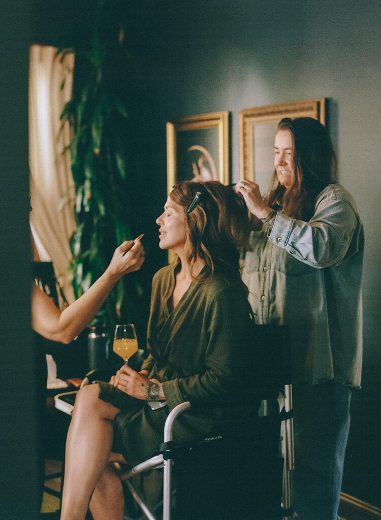 Bride getting hair and makeup done at getting ready location in Nevada City