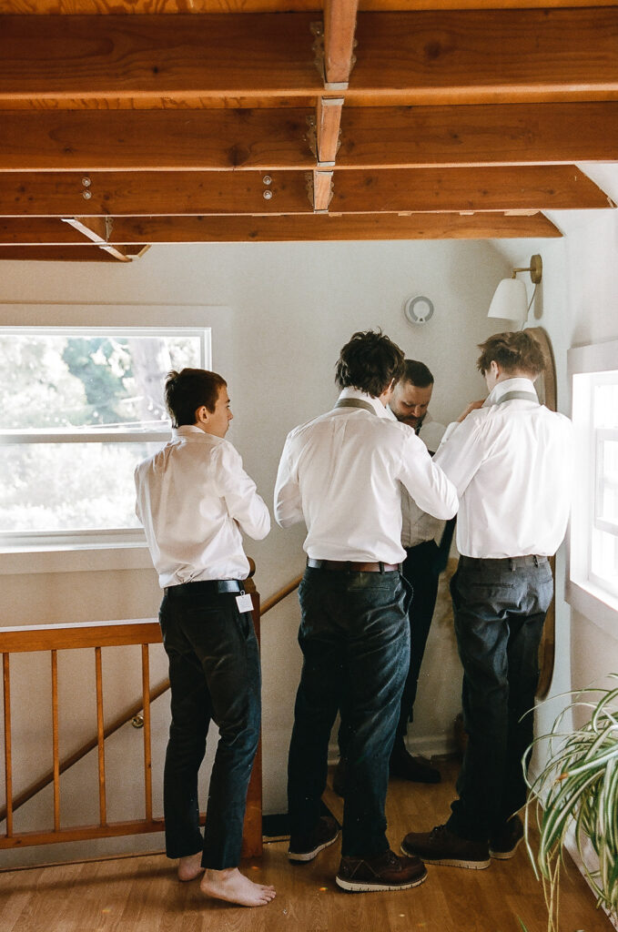 Groom getting ready with groomsmen at Nevada City wedding