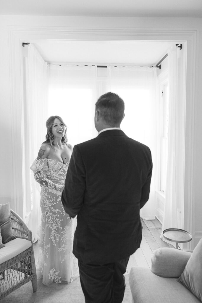 Bride and groom sharing an emotional first look in bright window light at The Parsonage 1865 during Miners Foundry wedding in Nevada City, California.