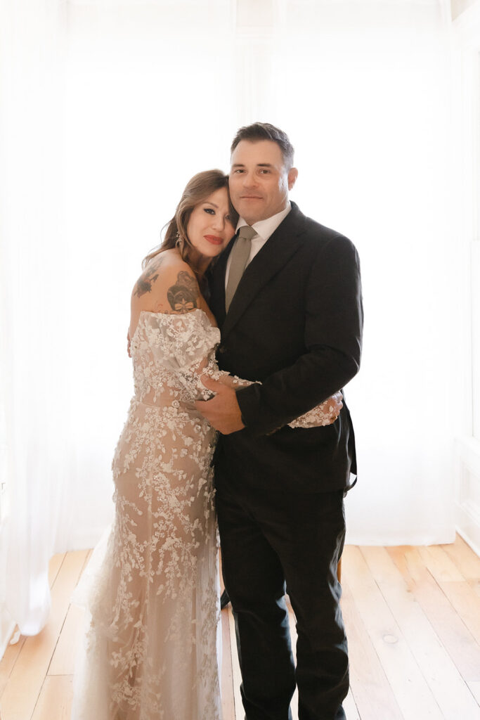 Bride and groom posing for a portrait at The Parsonage 1865 during Miners Foundry wedding in Nevada City, California.
