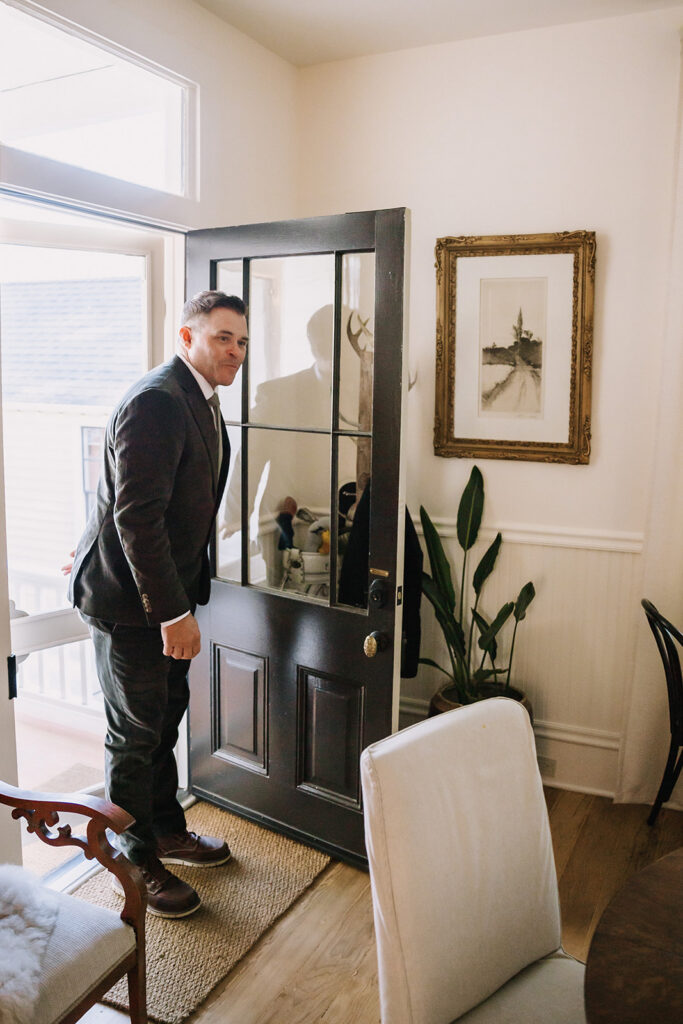 Groom entering to share a first look with his bride.