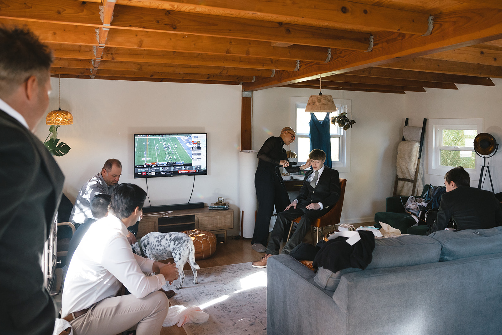 Groom and groomsmen getting ready together in natural light at The Parsonage 1865 during Miners Foundry wedding in Nevada City, California.