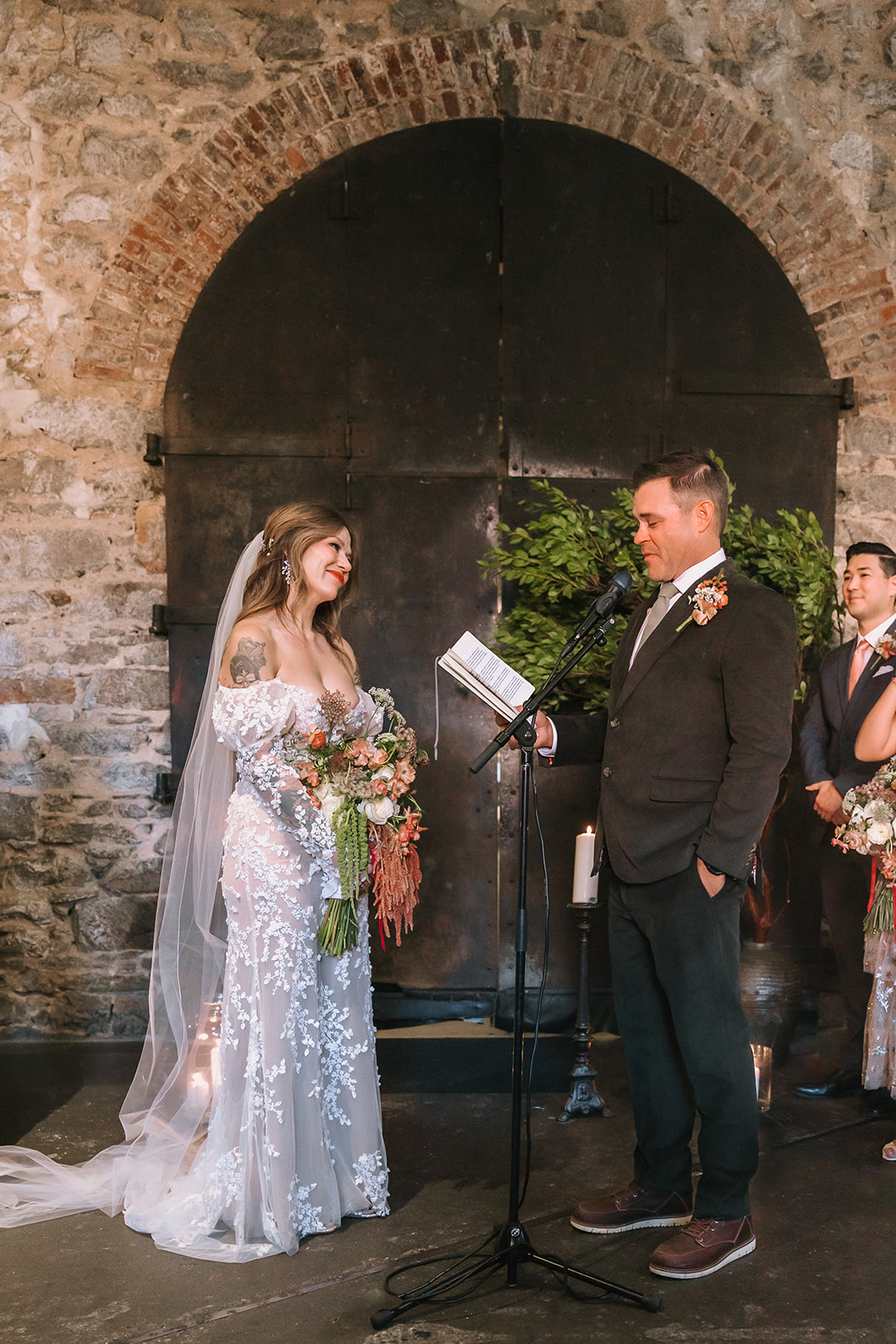 Bride and groom exchanging vows during intimate ceremony in the Upper Gallery at Miners Foundry wedding in Nevada City, California.