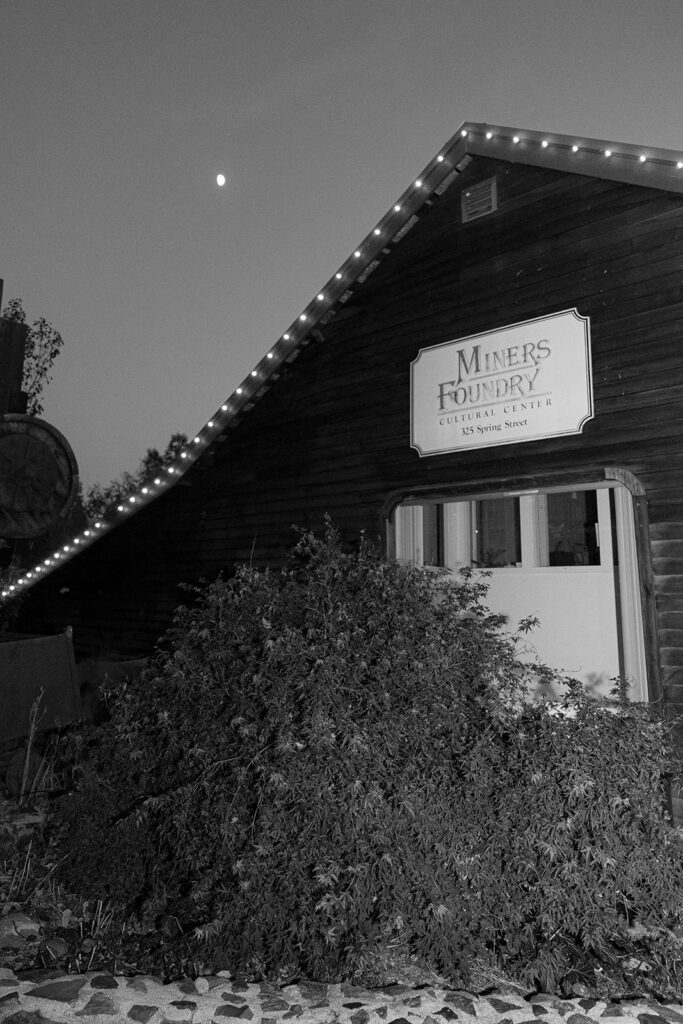 Exterior of Miners Foundry Cultural Center at night in Nevada City, California wedding.