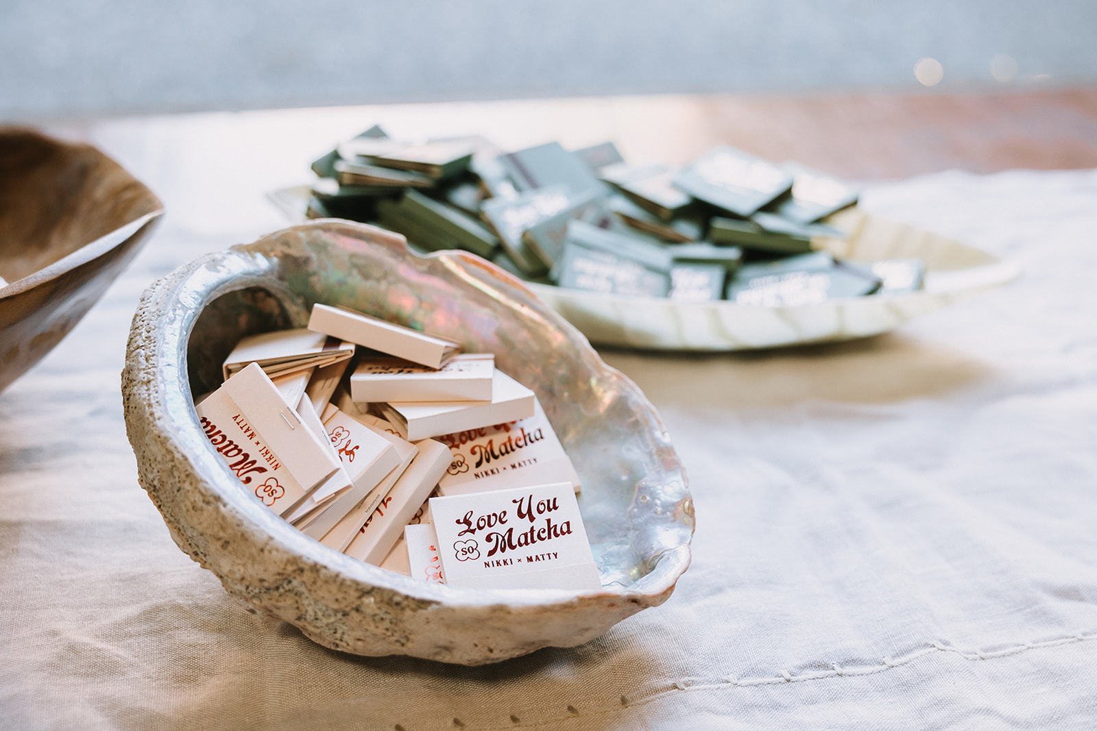 Custom wedding matches in decorative bowl reading love you matcha at Miners Foundry wedding in Nevada City, California.