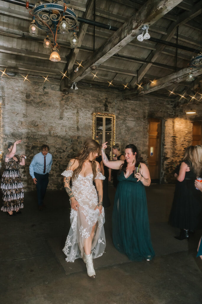 Bride dancing with guests during the reception. 