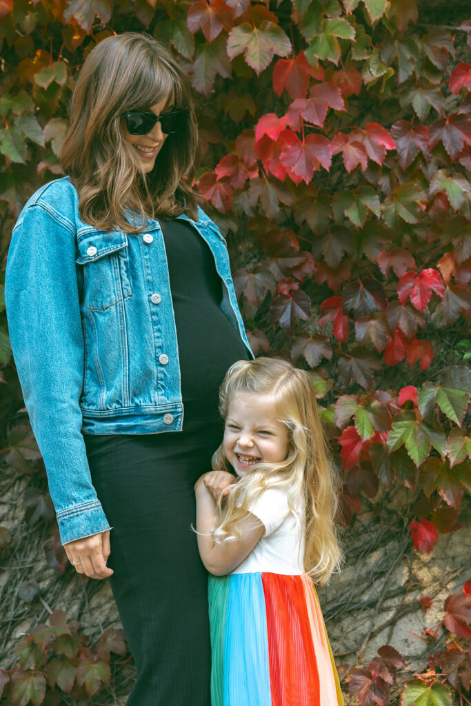 Mother posing with her daughter. 