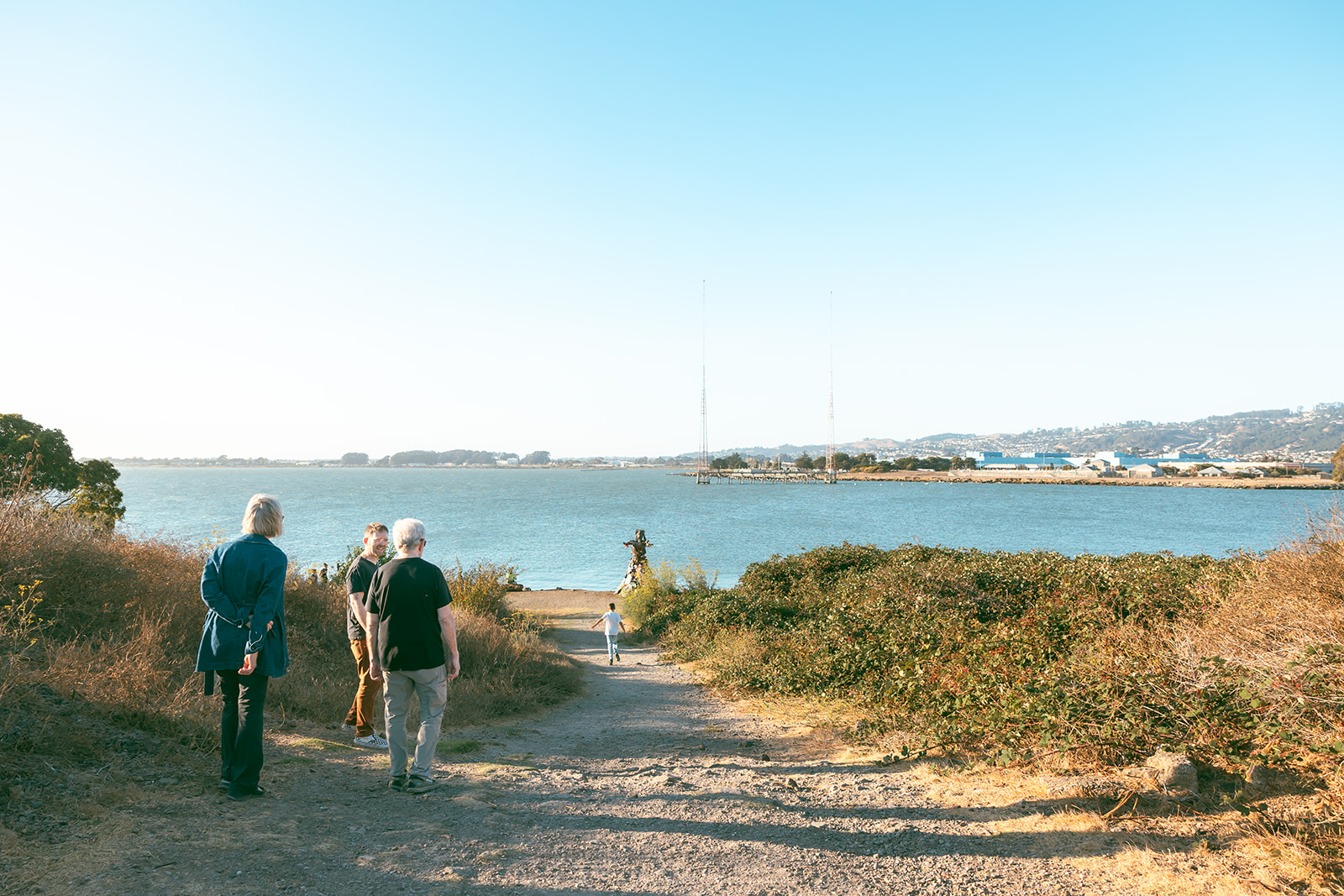 Family walking down to the beachy area at Albany Bulb in the East Bay. 