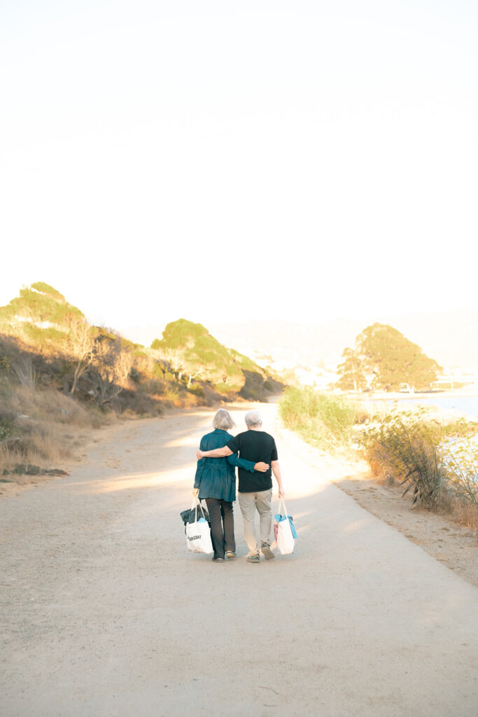 Couple walking and holding each other. 
