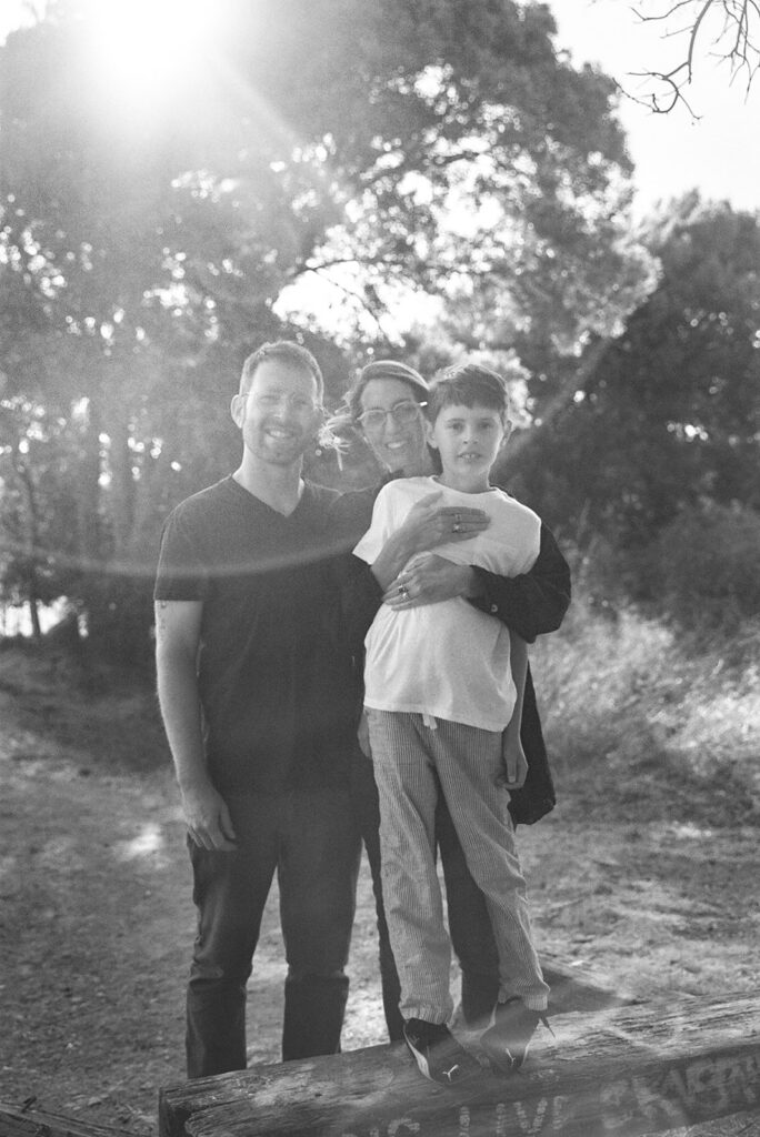Black and white film portrait of parents and child during East Bay family session.