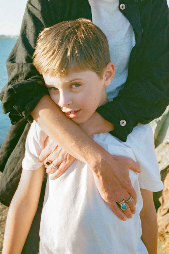Close up photo of a mother holding her young son.