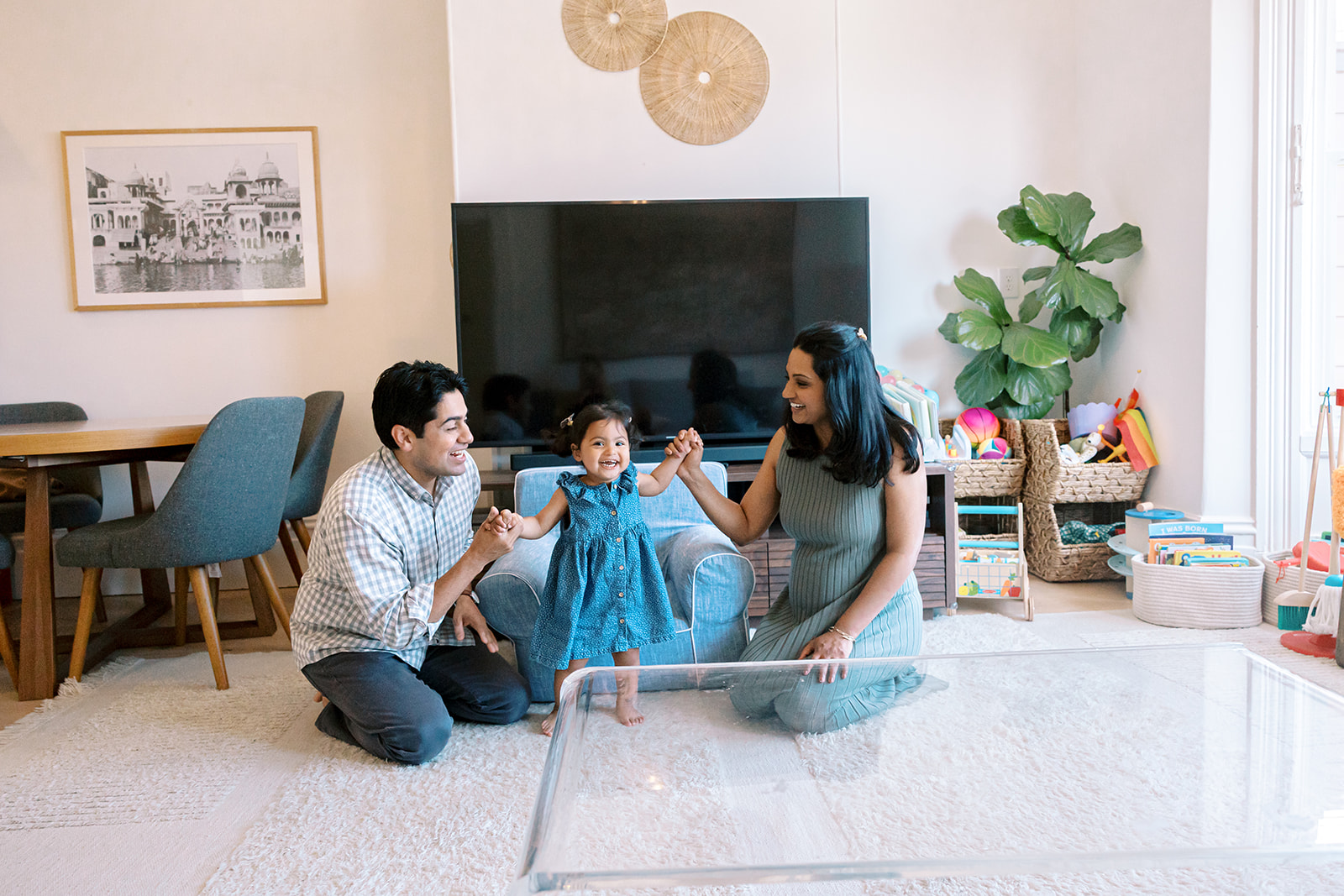 Family of three in the living room during at home and San Francisco maternity photos. 