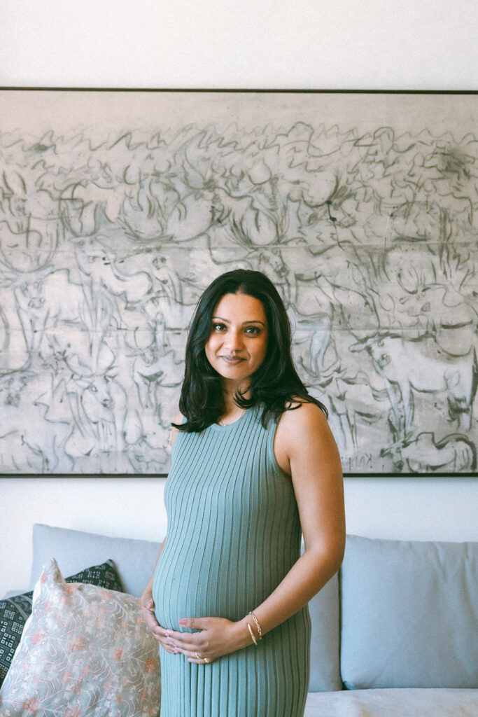 Pregnant woman posing inside her home for her San Francisco maternity photos at home.
