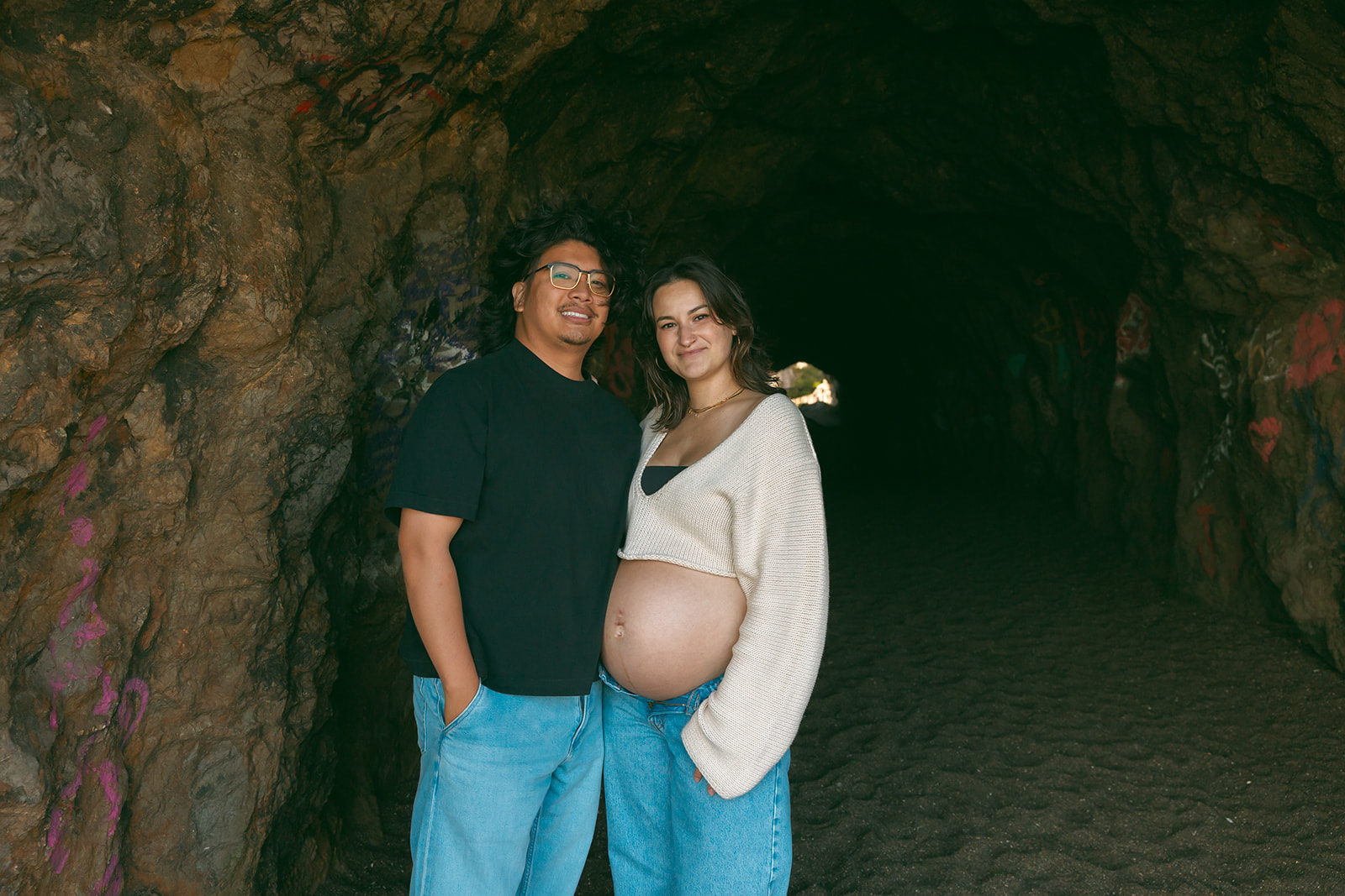 Couple posing in a tunnel at Lands End and Sutro Baths area in SF.