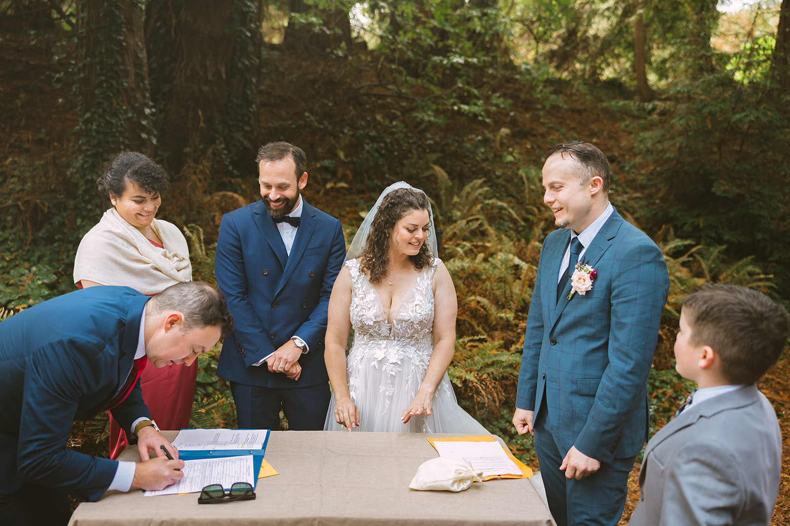 Bride and groom getting ready to sign their Ketubah after their ceremony.
