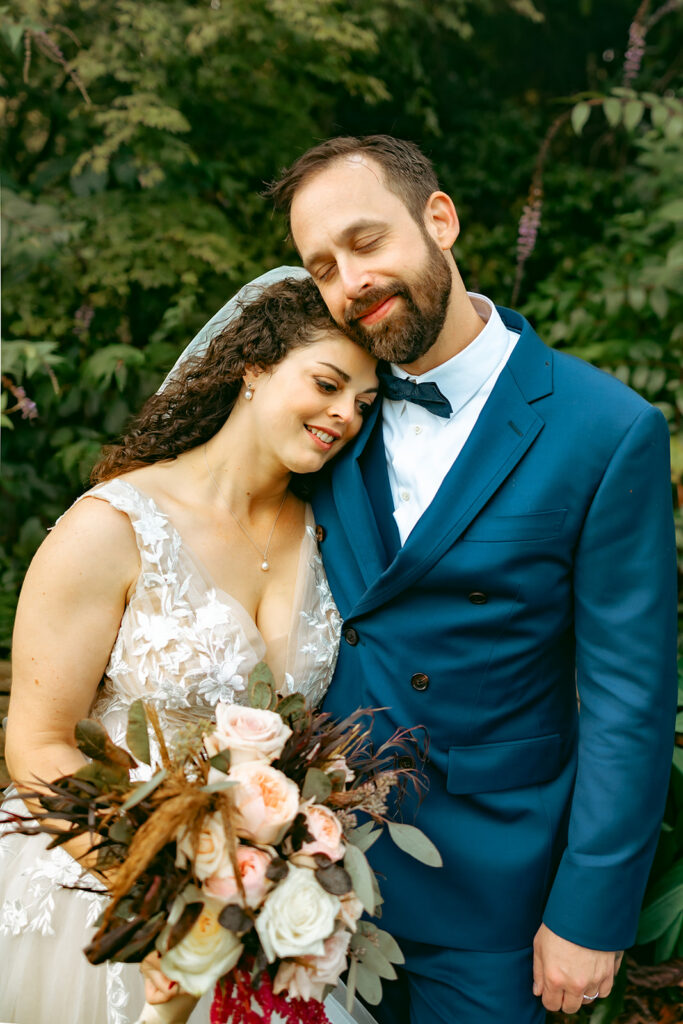 Bride and groom posing together during their portraits.