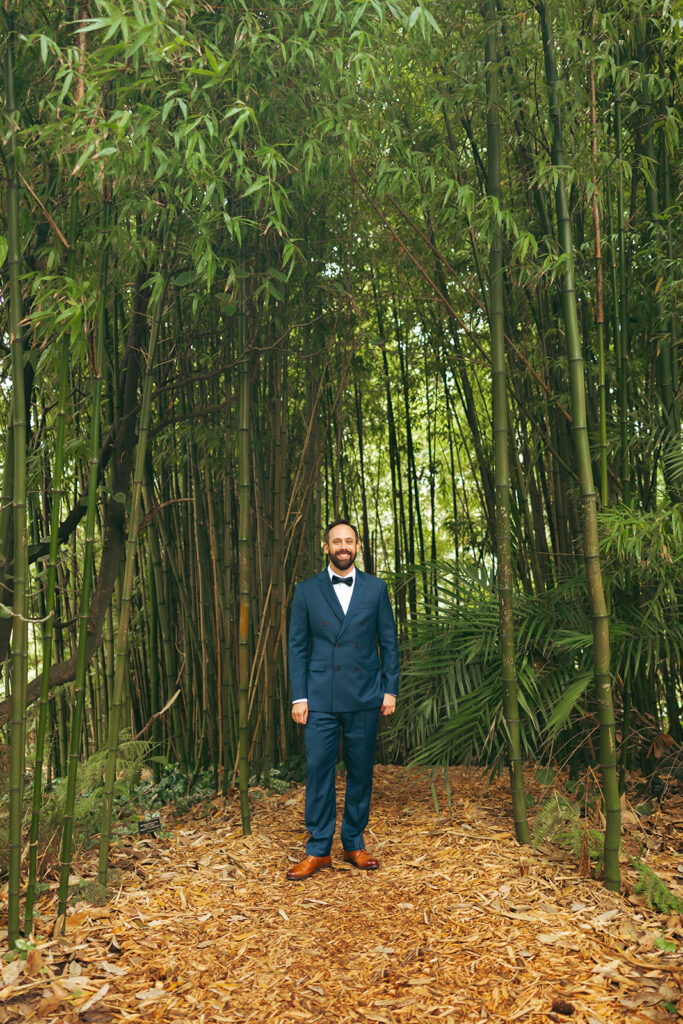Groom posing before his San Francisco Botanical Garden wedding.