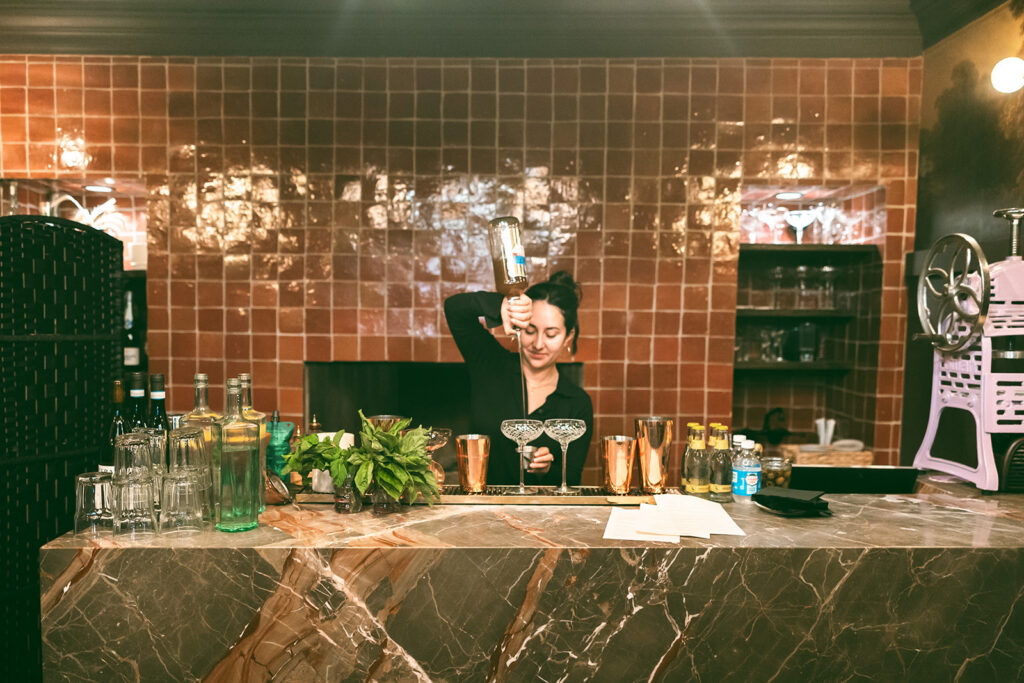 Bartender making drinks during a  San Francisco micro wedding reception at Fiorella.
