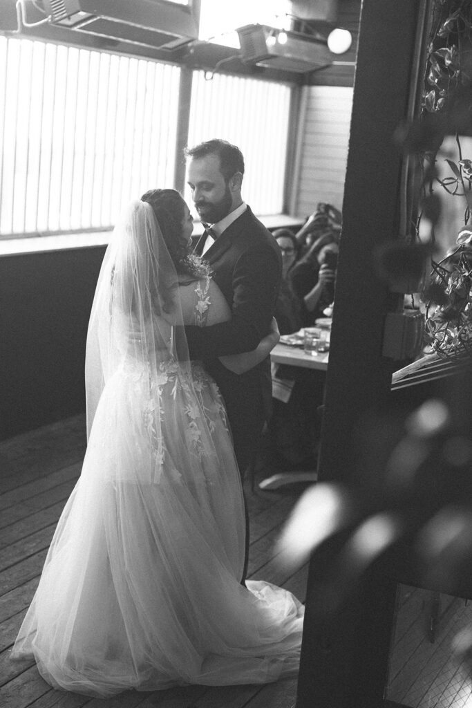 Bride and groom sharing a first dance during their  San Francisco micro wedding reception at Fiorella.