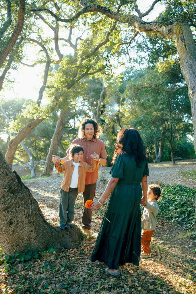 Family of four during their fall family photos at John Hinkel Park.