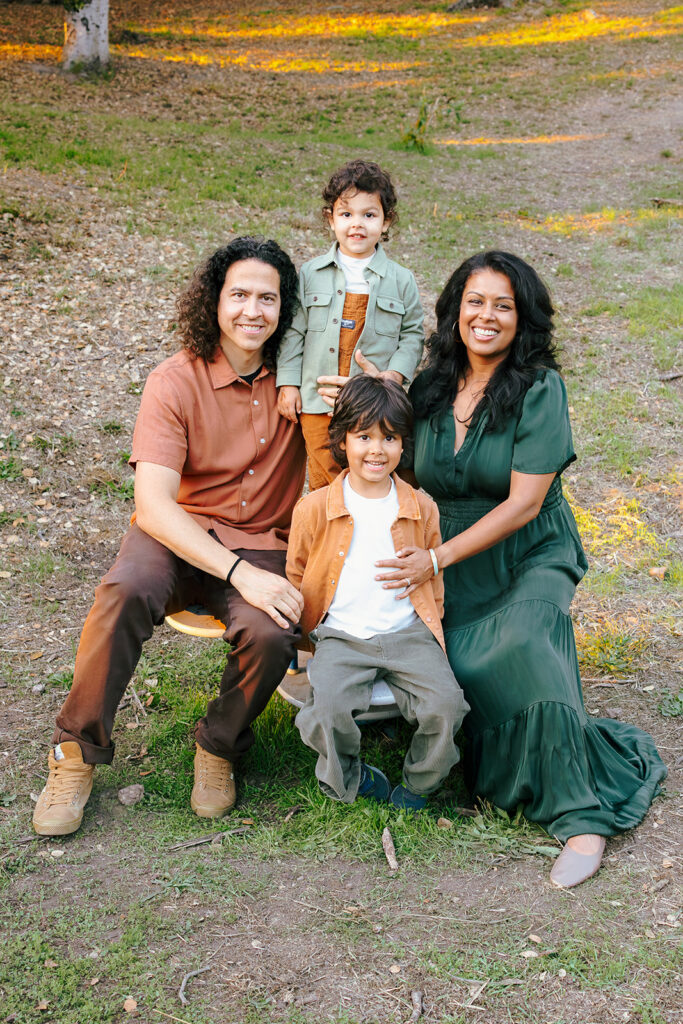 Family of four posing for a photo at John Hinkel Park for their East Bay family photos.