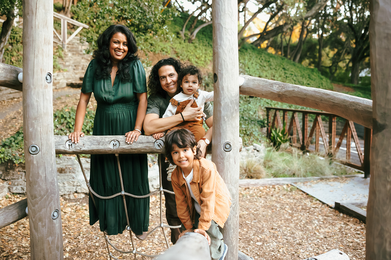 Family of four playing at John Hinkel Park during their fall East Bay family photos.