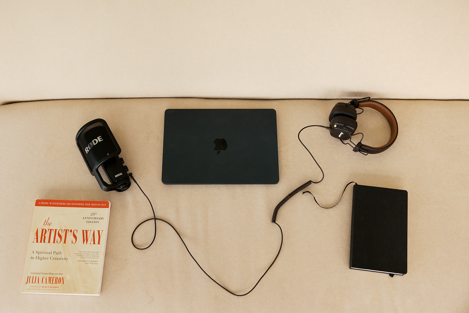 Laptop, podcast microphone, and heading phones styled for a Bay Area therapist branding photoshoot in studio. 
