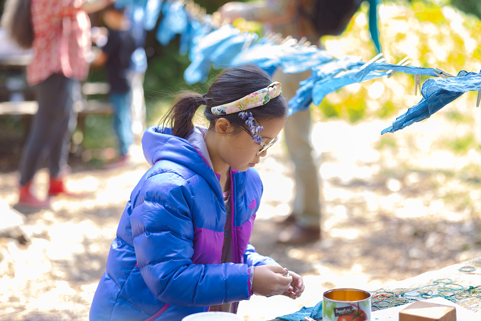 Young girl doing tie dye painting. 