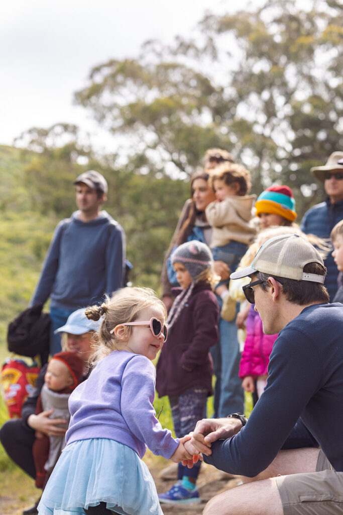 Guests watching goat milking at the ranch.