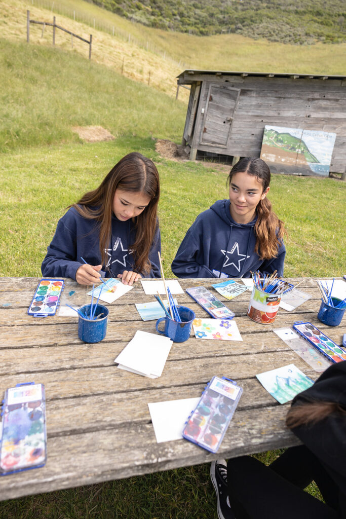Kids painting at Slide Ranch during the 2025 Spring Fling.