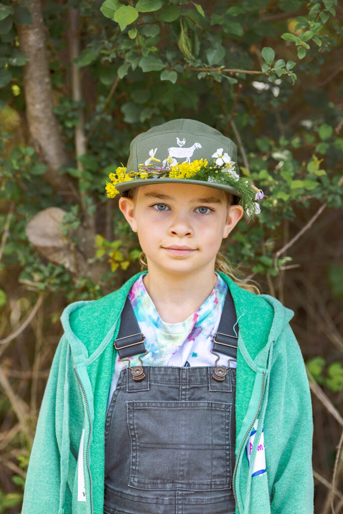 Boy wearing a flower crown.