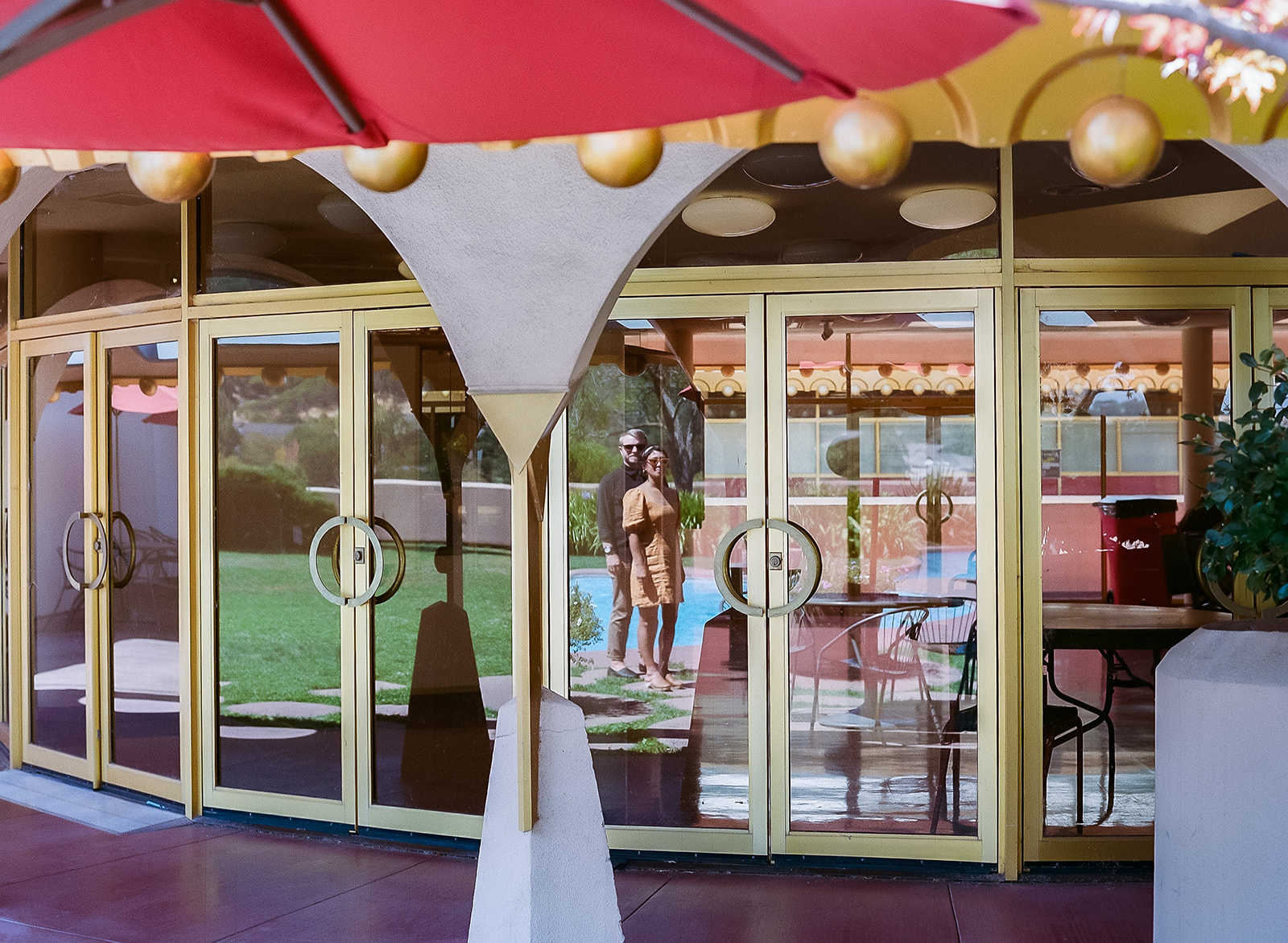 35mm film photo of the reflection of a couple at Marin Cunty Civic Center for their Bay Area engagement photos.