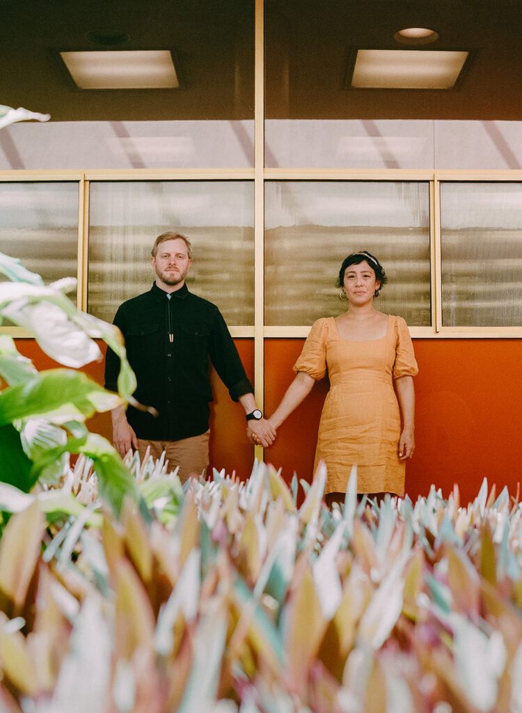 Creative Bay Area engagement photos with a couple holding hands at Marin County Civic Center.