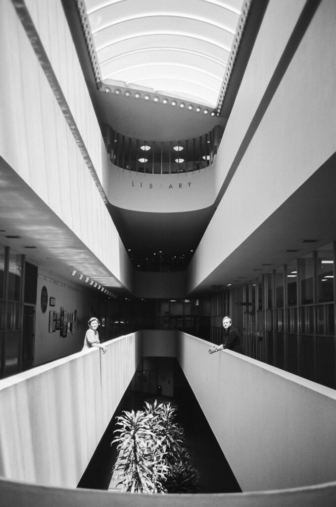 Black and white photo of a couple standing across one another at Marin County Civic Center for their Bay Area engagement photos,