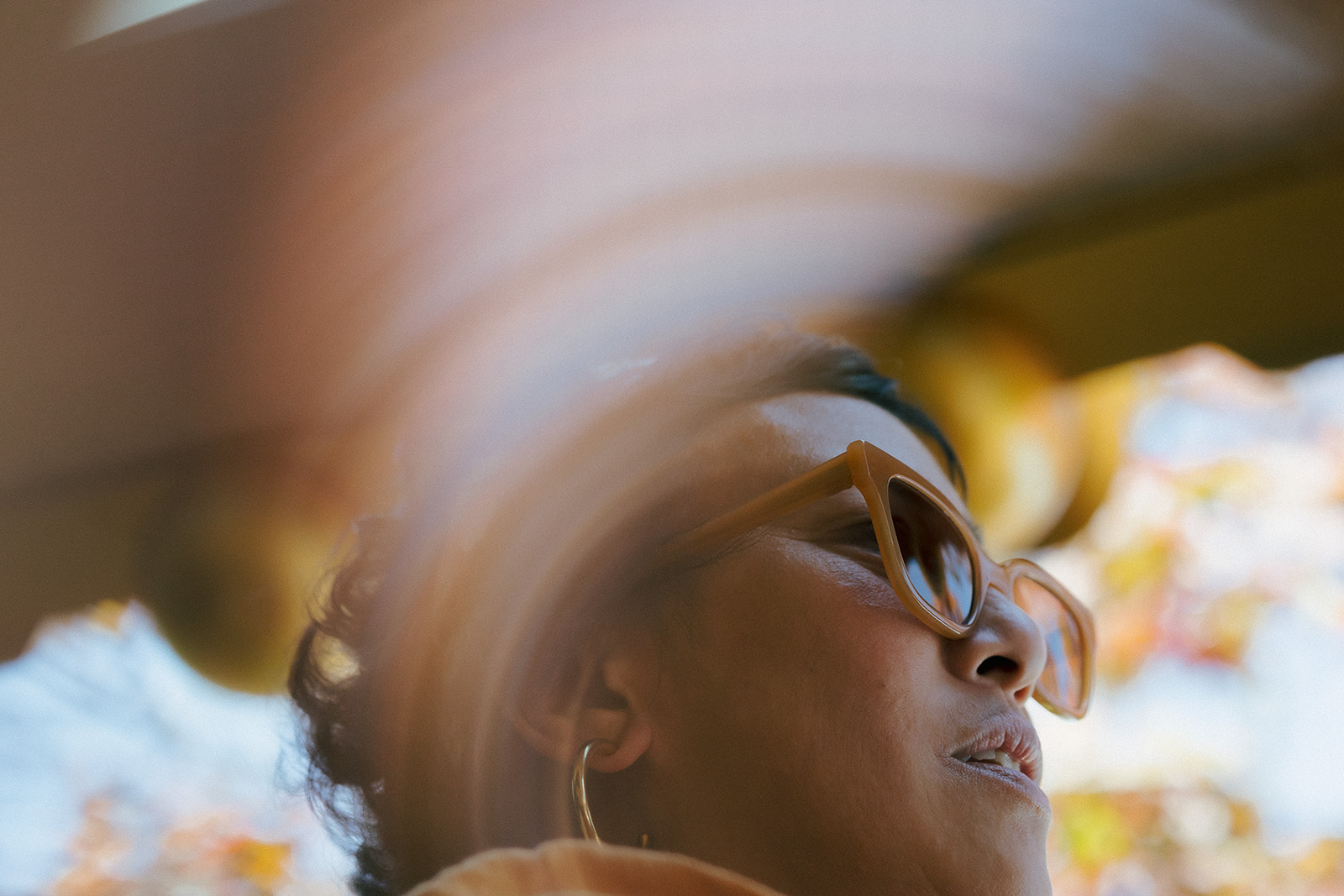 Close-up engagement portrait of a woman in sunglasses at Marin County Civic Center.