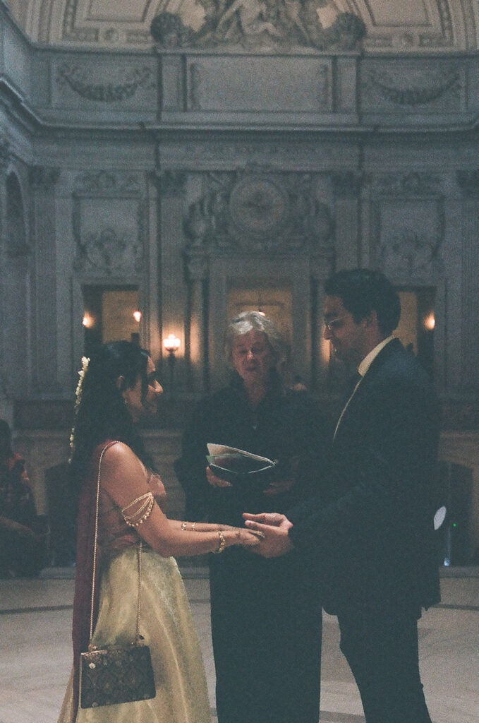 Couple standing together during their civil wedding ceremony at San Francisco City Hall.