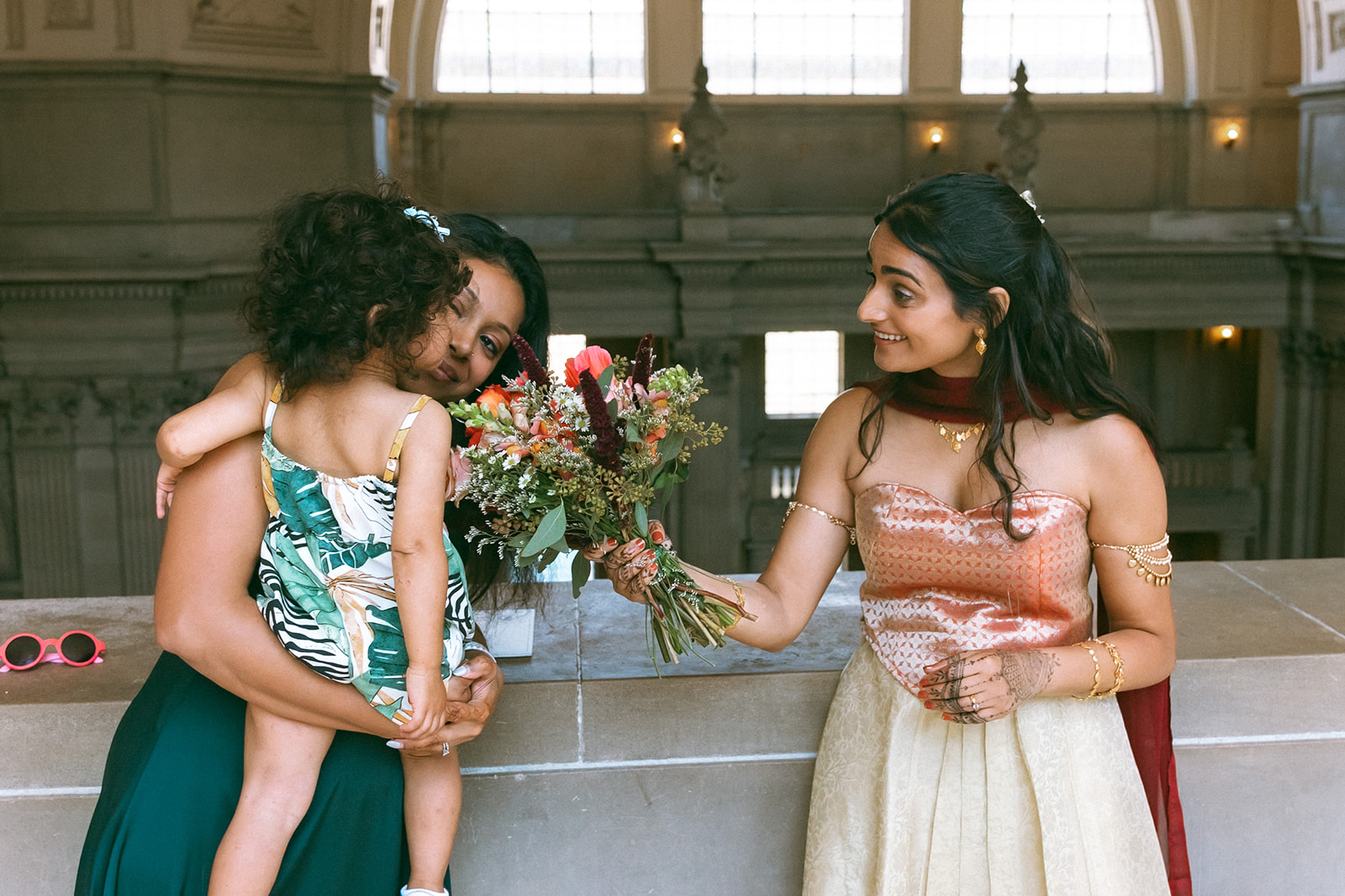 Bride interacting with family during her portraits.