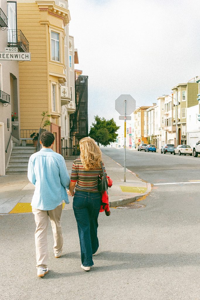 Couple walking the streets of North Beach.